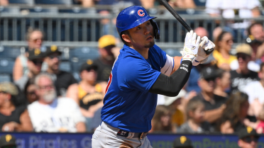 The Chicago Cubs' Seiya Suzuki (R) sits in the dugout after striking out in  the seventh inning of a baseball game against the Arizona Diamondbacks on  May 22, 2022, at Wrigley Field