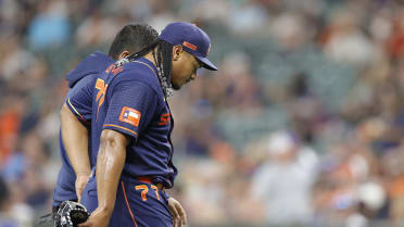 Luis Garcia of the Houston Astros looks on from the dugout before