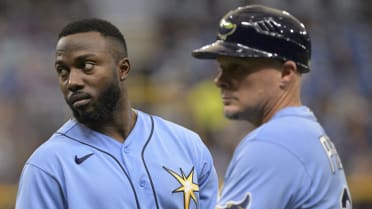 Tampa Bay Rays assistant hitting coach Dan DeMent, right, shakes