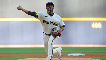 Julio Teheran of the Milwaukee Brewers reacts as he walks off the