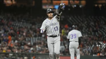 Colorado Rockies' Alan Trejo celebrates as he circles the bases after  hitting a solo walk-off home run against New York Yankees relief pitcher Ron  Marinaccio in the 11th inning of a baseball