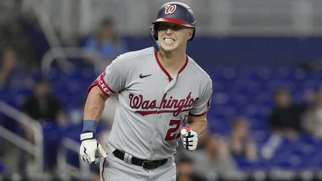 Ryan Goins counsels grounds crew on new dirt infield at the Rogers Centre -  The Globe and Mail