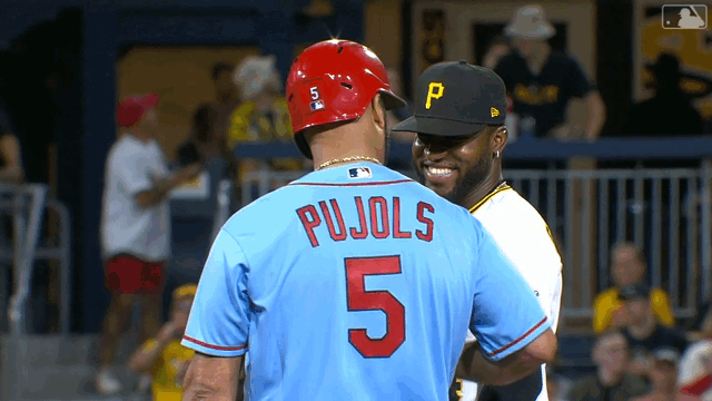 Albert Pujols, Rodolfo Castro chat at second base during game