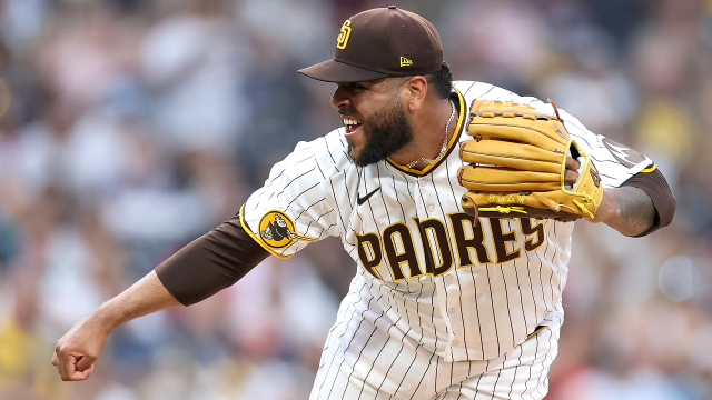 San Diego Padres' Victor Caratini heads up the first-base line after  connecting for a grand slam off Colorado Rockies relief pitcher Robert  Stephenson in the sixth inning of game one of a