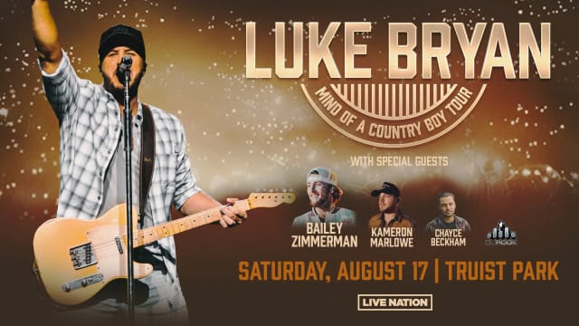Luke Bryan performing live at a country concert in 2025
