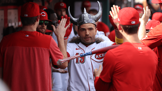 Right before hitting a grand slam, Joey Votto attempted to shoo a bird away  that was interrupting the game