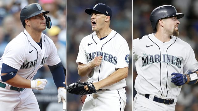 Seattle Mariners' Tom Murphy reacts in the dugout after he hit a