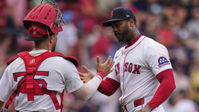 Red Sox rally late to win suspended game against Reds