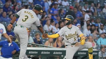 A's top prospect one-ups father with triple at Wrigley