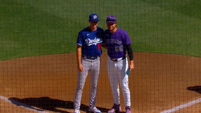 Jared Karros and Kyle Karros exchange lineup cards