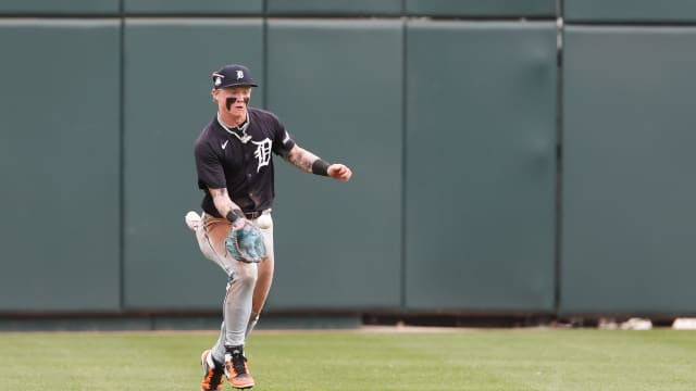 Max Clark throws behind the runner for the out