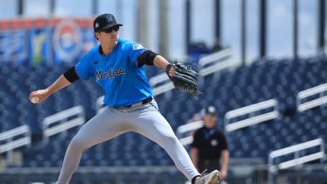Aiden May wearing sunglasses on the mound