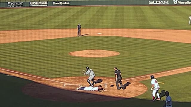 Benjamin Cowles races for an RBI triple