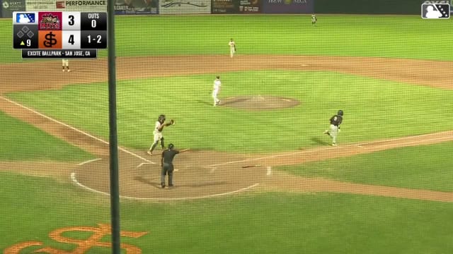 Drew Cavanaugh throws the runner out on a wild pitch 