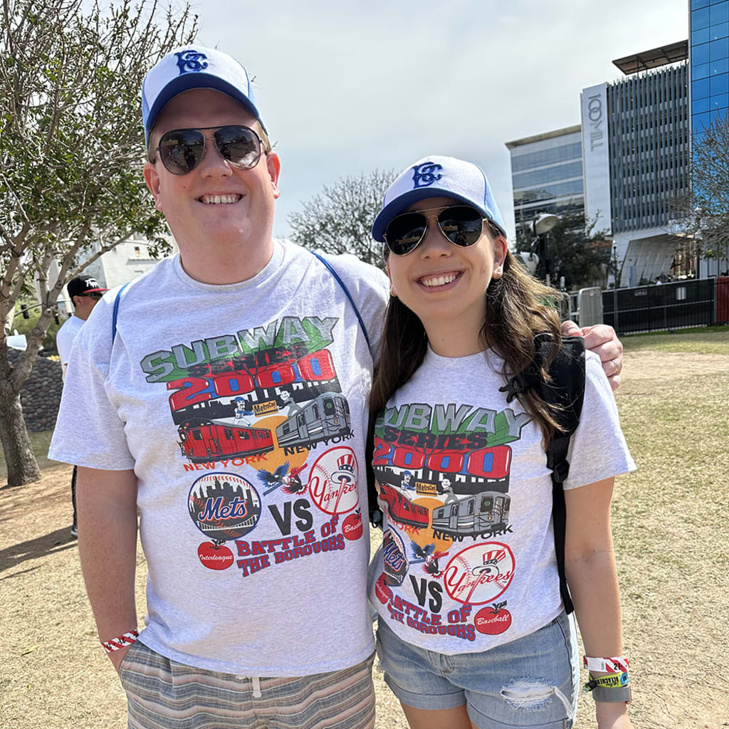 This couple got into the spirit with matching 2000 Subway Series shirts