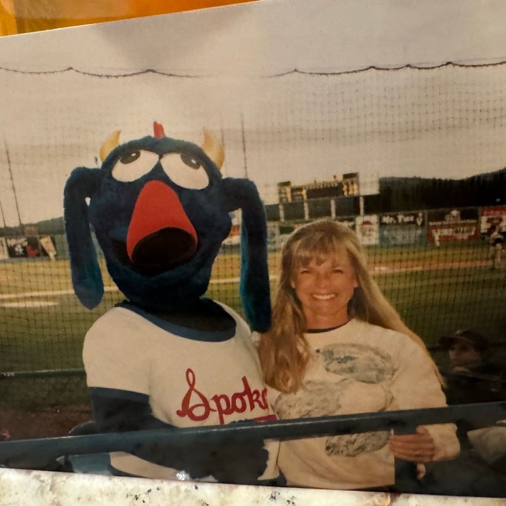Spokane manager Tim Flannery, as Otto the mascot, alongside his wife, Donna