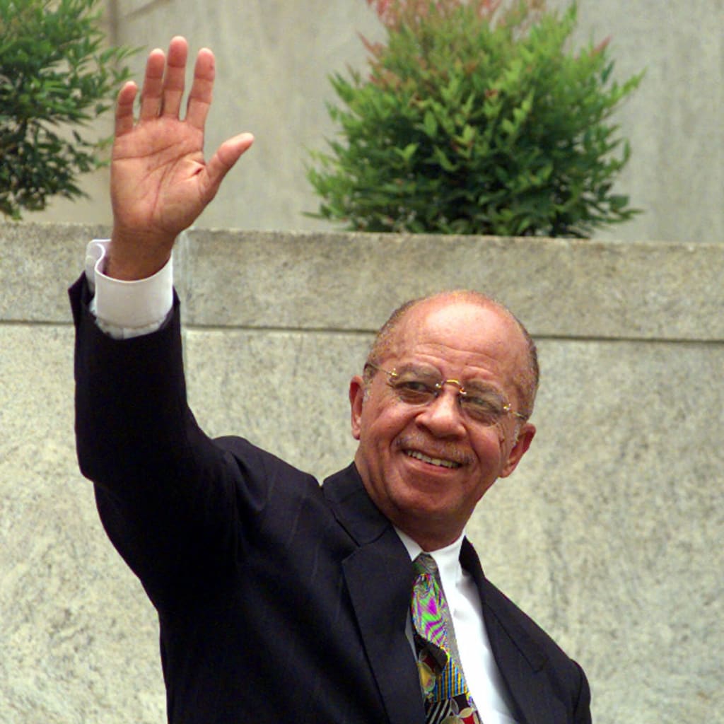 Mayor Richard Arrington waves to reporters outside the Birmingham City Hall on Wednesday, July 7, 1999.