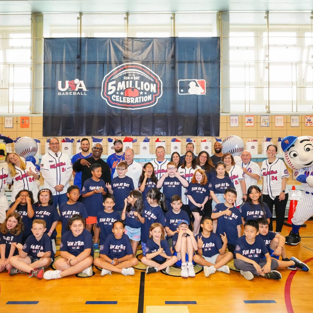 Fun At Bat participants pose for a group photo with special guests. (Mary DeCicco/MLB Photos via Getty Images)