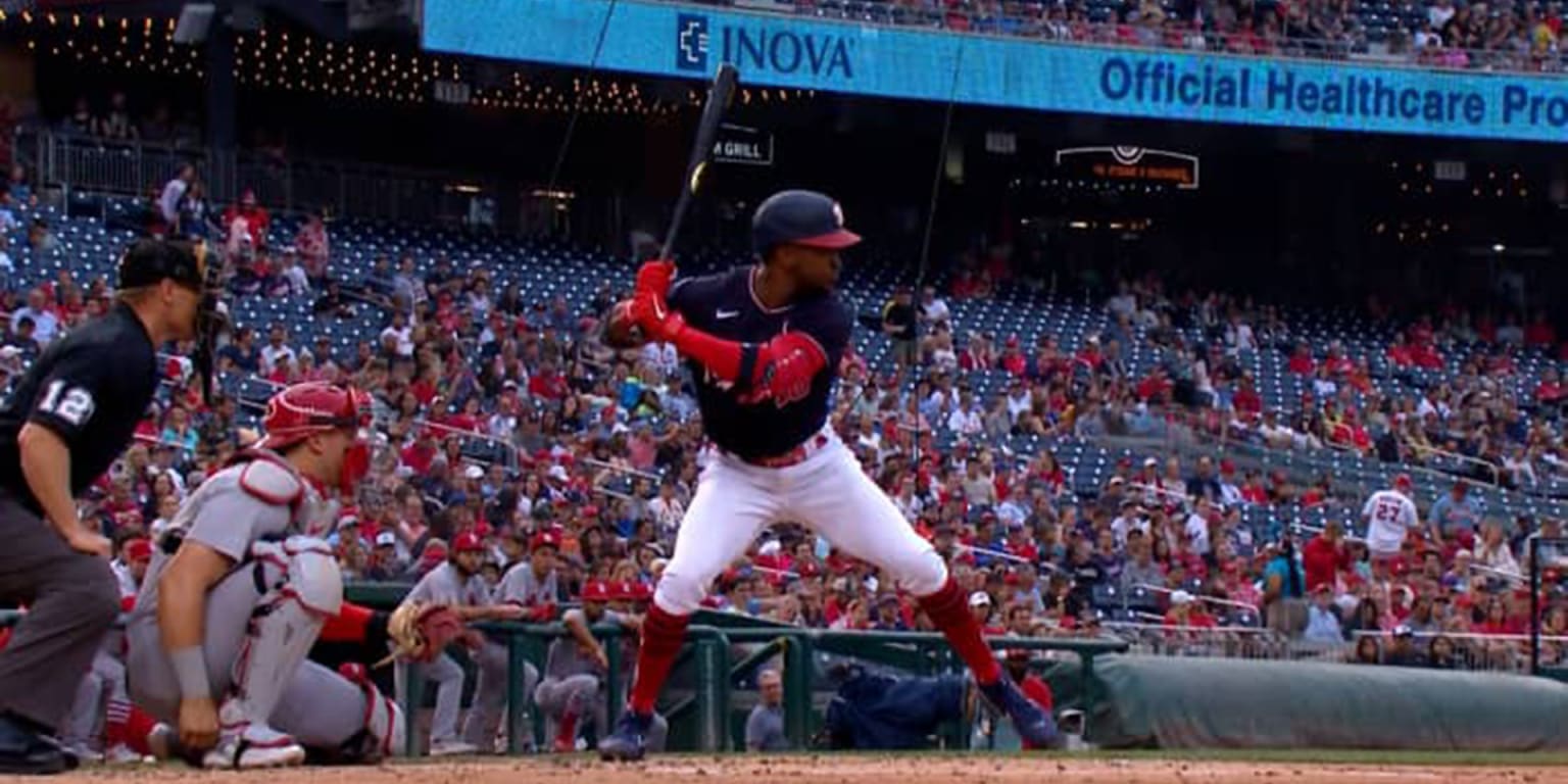 Washington Nationals' Victor Robles walks in the dugout after