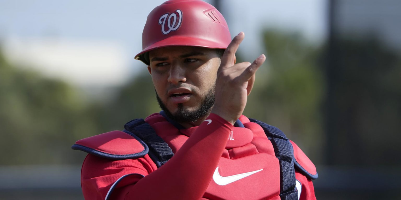 Washington Nationals' Keibert Ruiz looks toward teammates in the