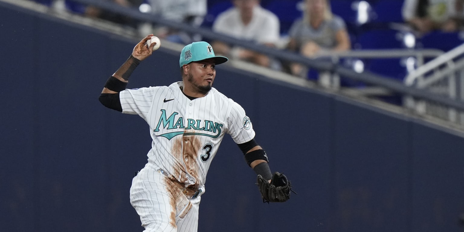 Marlins lose opener to Brewers, narrowly avoid shutout