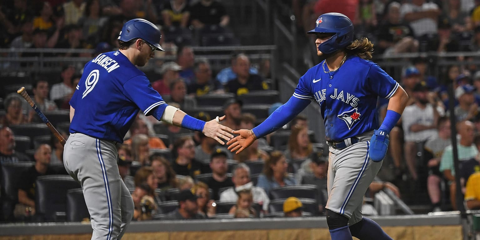 Bo Bichette of the Toronto Blue Jays smiles as he jogs off the