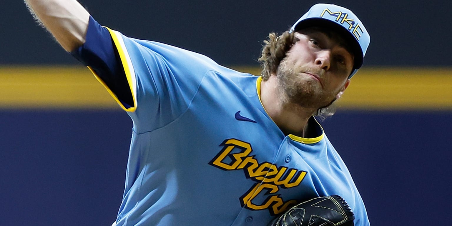 Milwaukee Brewers' Corbin Burnes adjusts his hair during the sixth