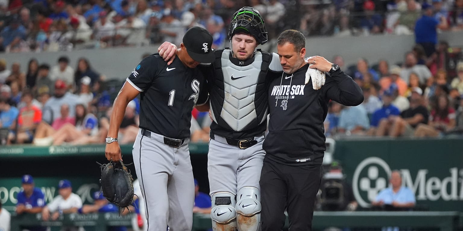 Teel helped off the field after injury during play at plate