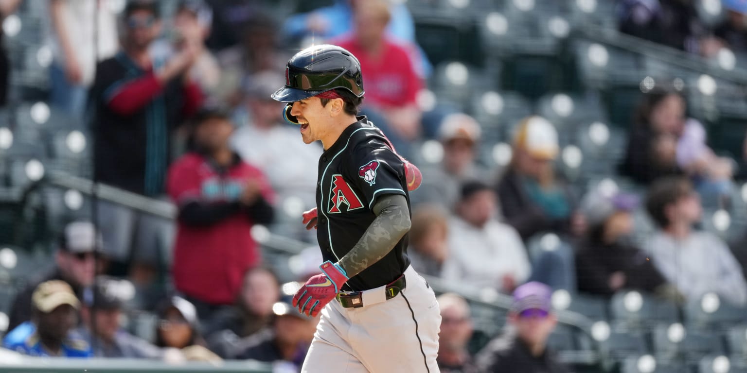 Carroll homers twice as D-backs erupt, then hold off Rox late rally