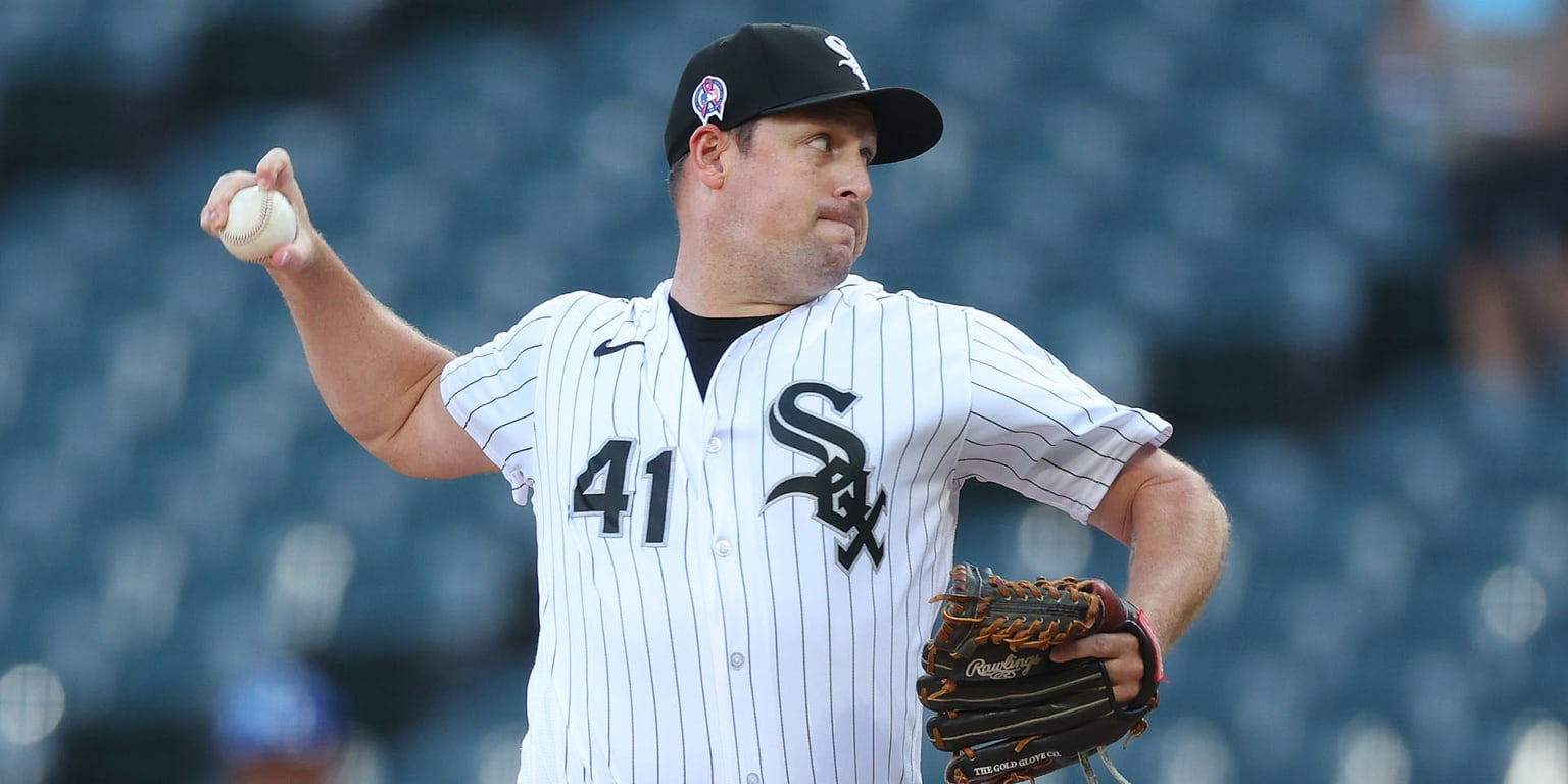 Chicago White Sox relief pitcher Bryan Shaw, right, throws out New