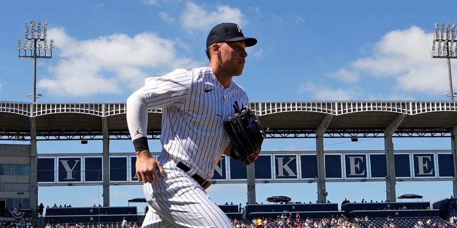 TAMPA, FL - MARCH 24: New York Yankees Outfield Aaron Judge (99) gives a  thumbs up to a young man who offered to trade jerseys with Judge during the spring  training game