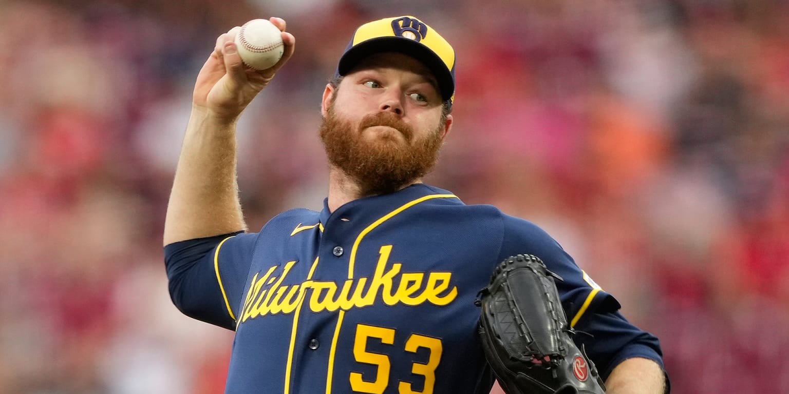 Woodruff carries perfect game into 6th in return from IL as Brewers win in 10