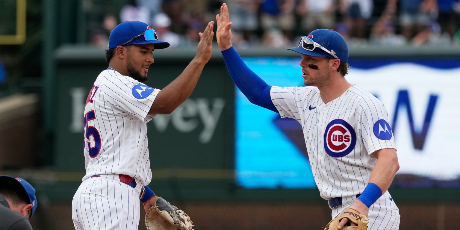 Cubs' 'pen holds strong after bats come through with late rally