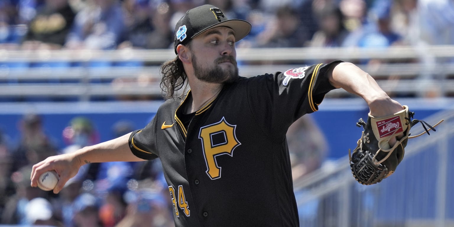 Pittsburgh Pirates starting pitcher JT Brubaker, left, tags out