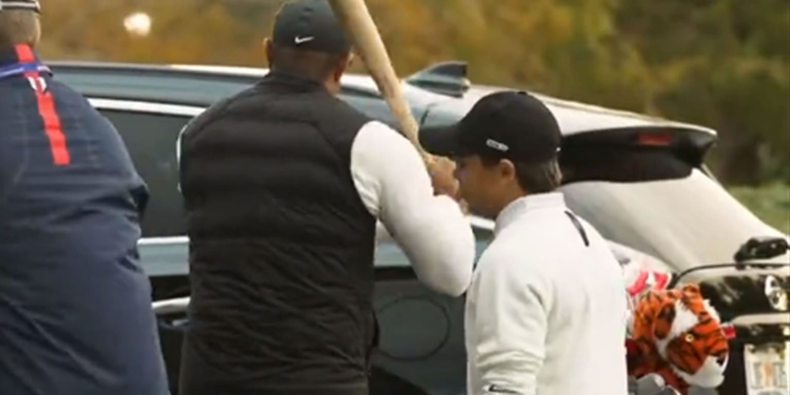 Tiger Woods practices his swing … with a bat?
