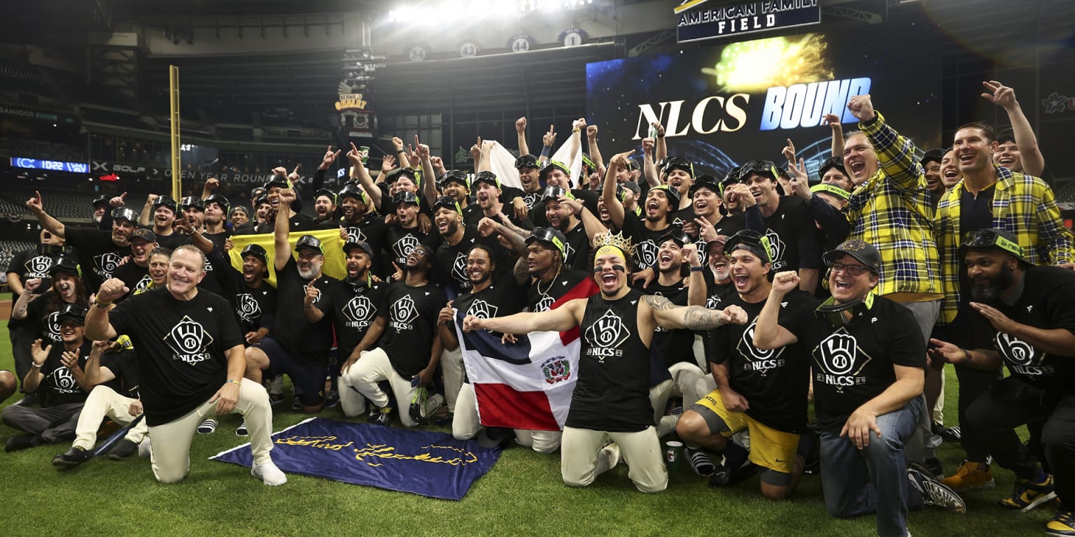 Milwaukee Brewers players celebrate together after reaching the National League Championship Series