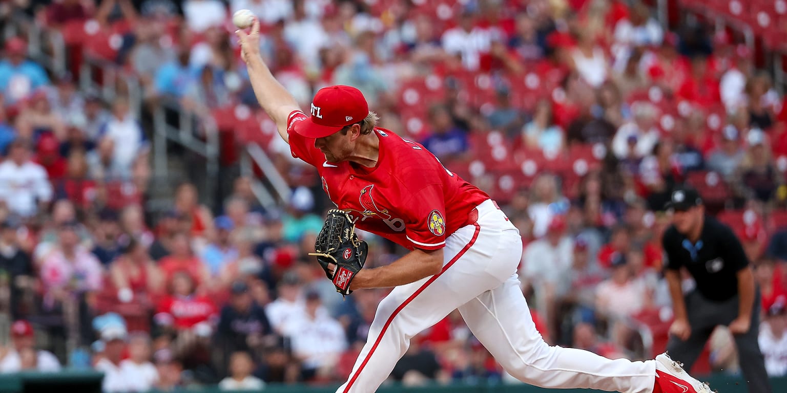 Cards wait out nearly 3-hour rain delay, then rally to beat Braves