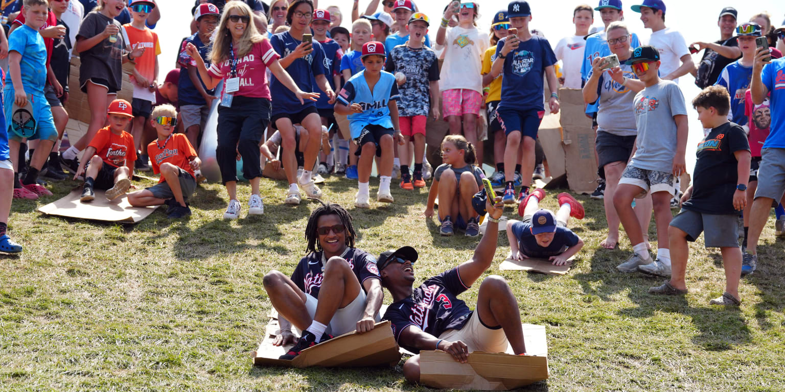 Nationals renew ritual of sliding down hill with Little Leaguers