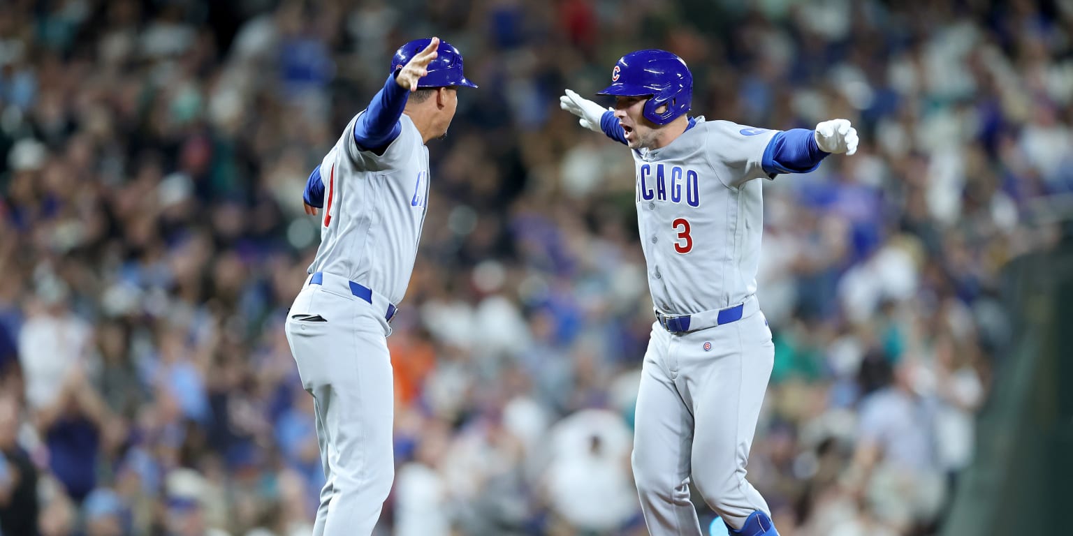 Bregman homers twice, but Cubs fall in extras