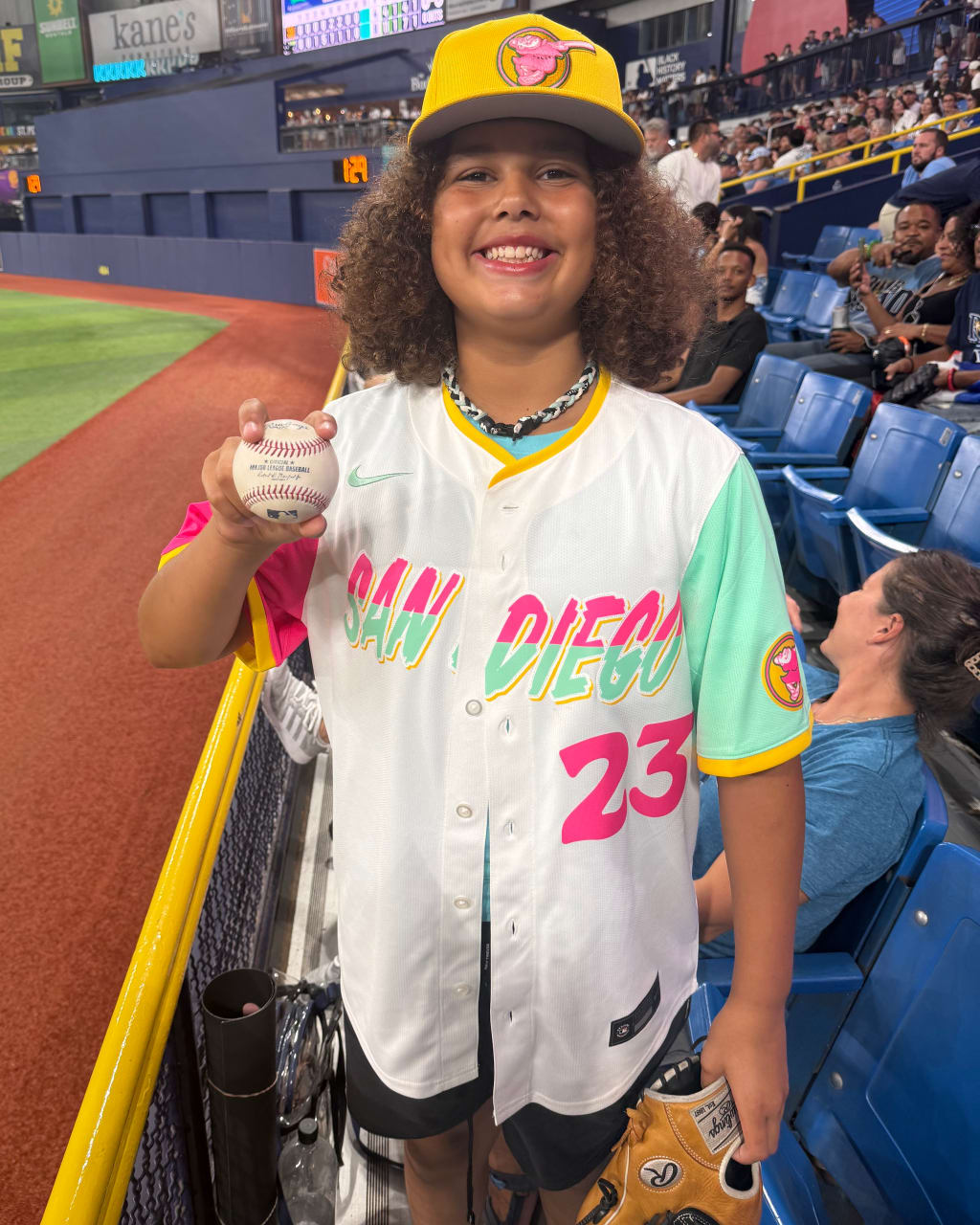 Fynn Szostak, 12, displays the home run ball that eluded Fernando Tatis Jr. on Friday night.