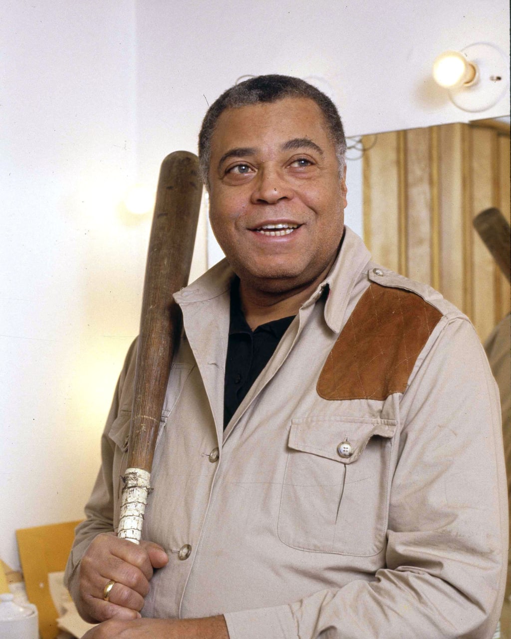 James Earl Jones poses with a baseball bat in his dressing room during rehearsals for "Fences" in March 1987.