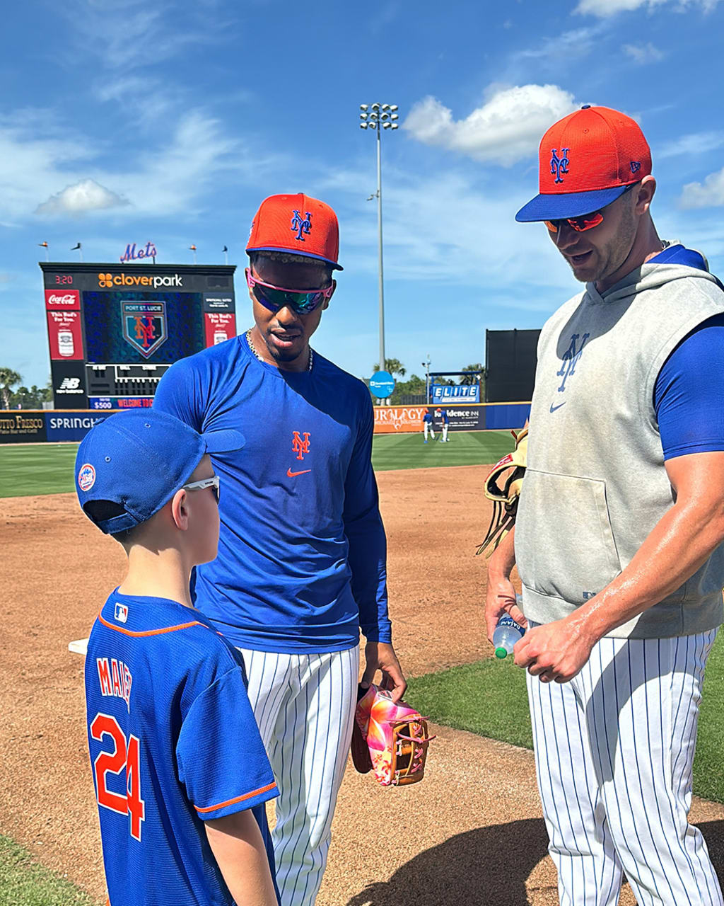 Mason Maier, Met for a Day, receives pointers from Francisco Lindor and Pete Alonso