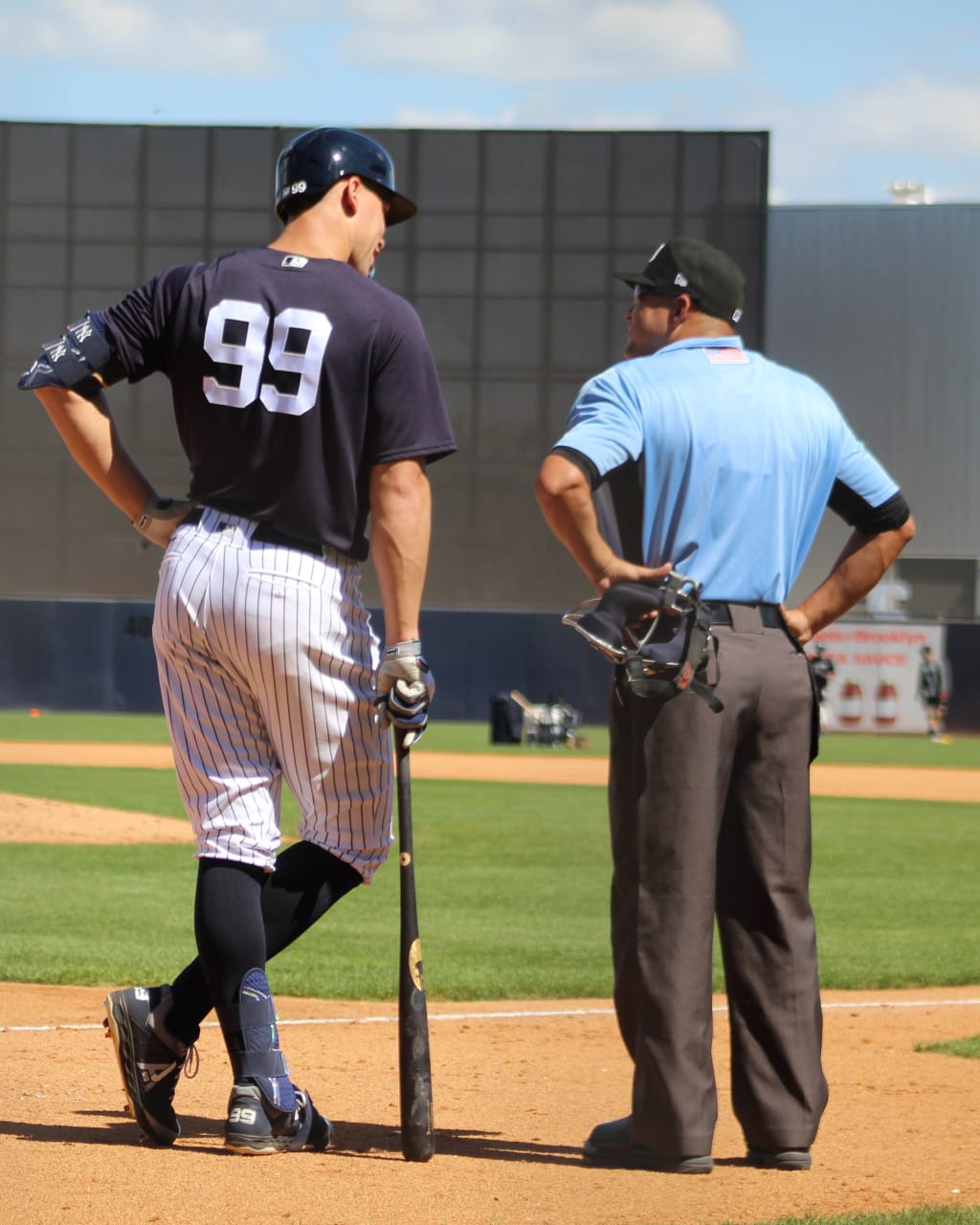 Aaron Judge chats with the Triple-A umpire who called balls and strikes Wednesday.