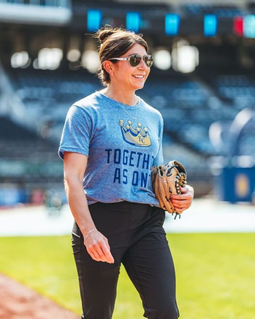 Royals director of behavioral science/Major League mental performance Melissa Lambert models the 'Together as One' T-shirt.