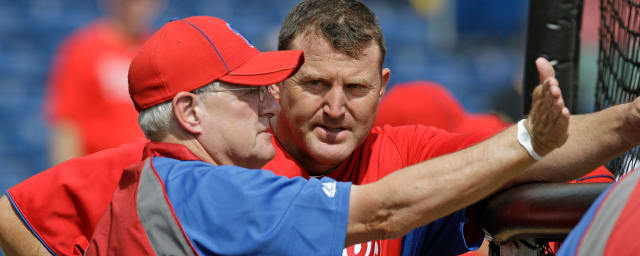 Philadelphia Phillies' Brad Lidge, right, and Carlos Ruiz celebrate after  winning Game 5 of the National League Championship baseball series against  the Los Angeles Dodgers Wednesday, Oct. 21, 2009, in Philadelphia. The