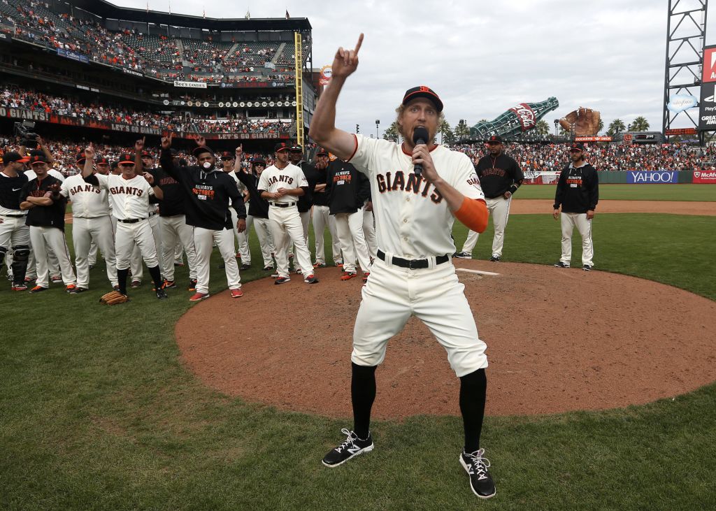 The San Francisco Giants' Hunter Pence leads the team in a cheer during the  celebration in the locker room following a series-clinching 6-3 win in Game  5 of the National League Championship