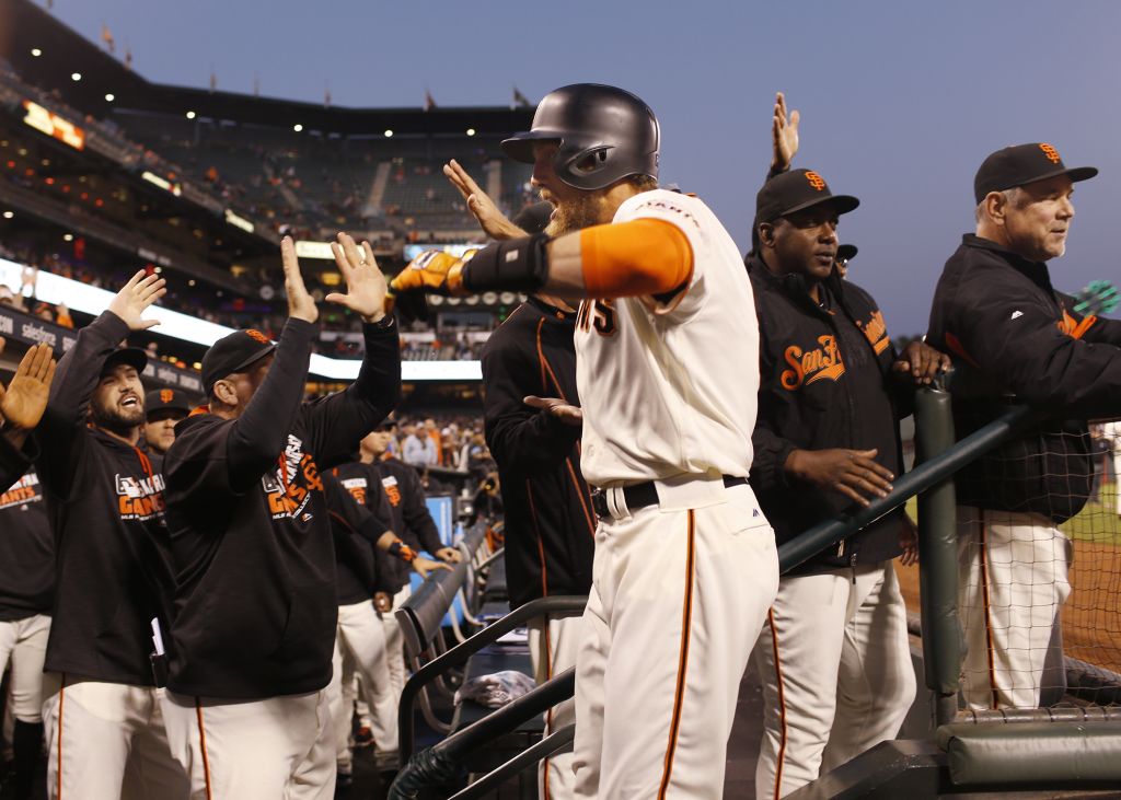 The San Francisco Giants' Hunter Pence leads the team in a cheer during the  celebration in the locker room following a series-clinching 6-3 win in Game  5 of the National League Championship