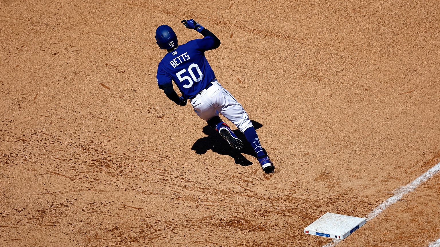 Los Angeles Dodgers' Will Smith, center, has his shirt ripped off by Kenley  Jansen, left, and Alex Verdugo after hitting a two-run walkoff home run  during the ninth inning of a baseball