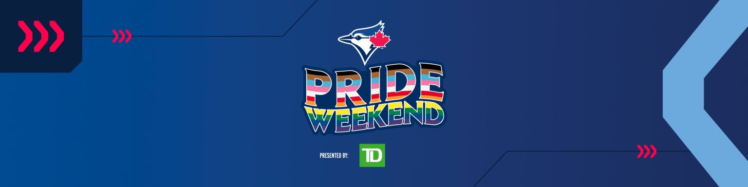 People hold a pride themed Toronto Blue Jays flag to celebrate Pride Weekend  before the Blue