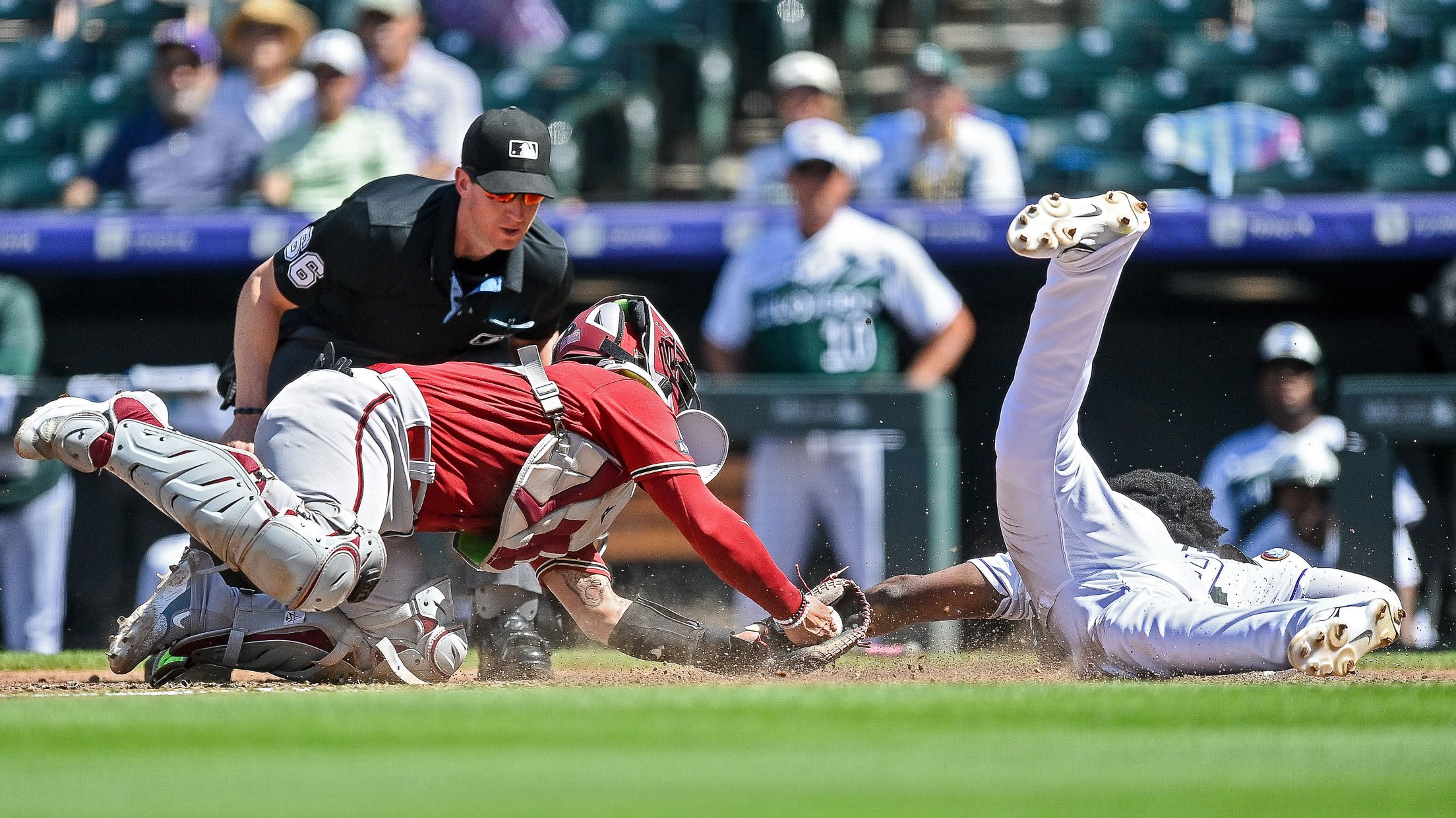 Umpire Calling Baseball Player Safe As He Slides At Home Plate High-Res  Stock Photo - Getty Images